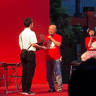 Takahashi Meijin (Hiroshi Takahashi) - Hudson Soft gaming icon and spokesperson, known for 16 button-presses per second