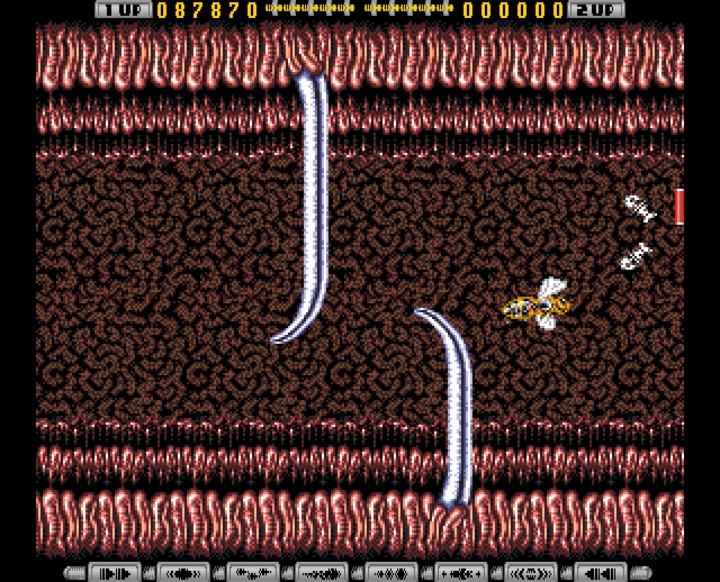 Apidya (1992, Amiga) - later stage screenshot showing increased visual complexity and enemy density